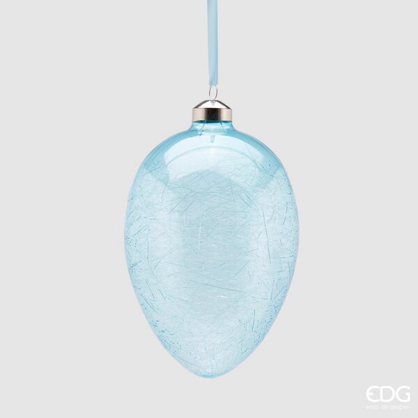 Uovo in vetro da appendere di colore azzurro. Dimensioni: Ø 9,5 x 13,5 h. In negozio e online su tuttochic.live