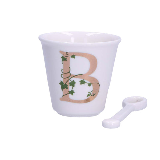 "Unico" Bicchierino in porcellana con iniziale decorata e cucchiaino. Capacità 75 cc Dimensioni: diametro cm 6,7- altezza cm 6 Lavare a mano Questo bicchierino può essere abbinato con il piattino