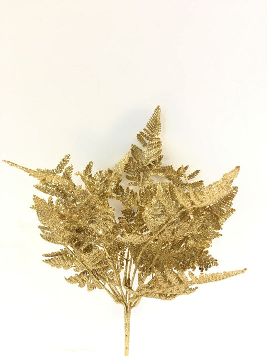 Cespuglio di Felce ornamentale artificiale di colore oro glitter. Dimensioni: cm 46 h. In negozio e online su tuttochic.live