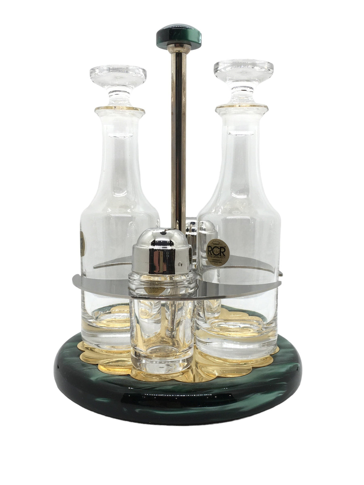 Completo olio, aceto, sale e pepe in acciaio inox, laminato oro 24k e madreperlato verde smeraldo con contenitori per olio, aceto, sale e pepe in cristallo liscio trasparente. Dimensioni: Ø cm 16 x 22, 5 h. Lavare a mano. In negozio e online su tuttochic.live