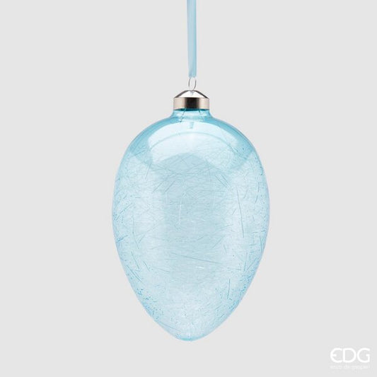 Uovo in vetro da appendere di colore azzurro. Dimensioni: Ø 9,5 x 13,5 h. In negozio e online su tuttochic.live