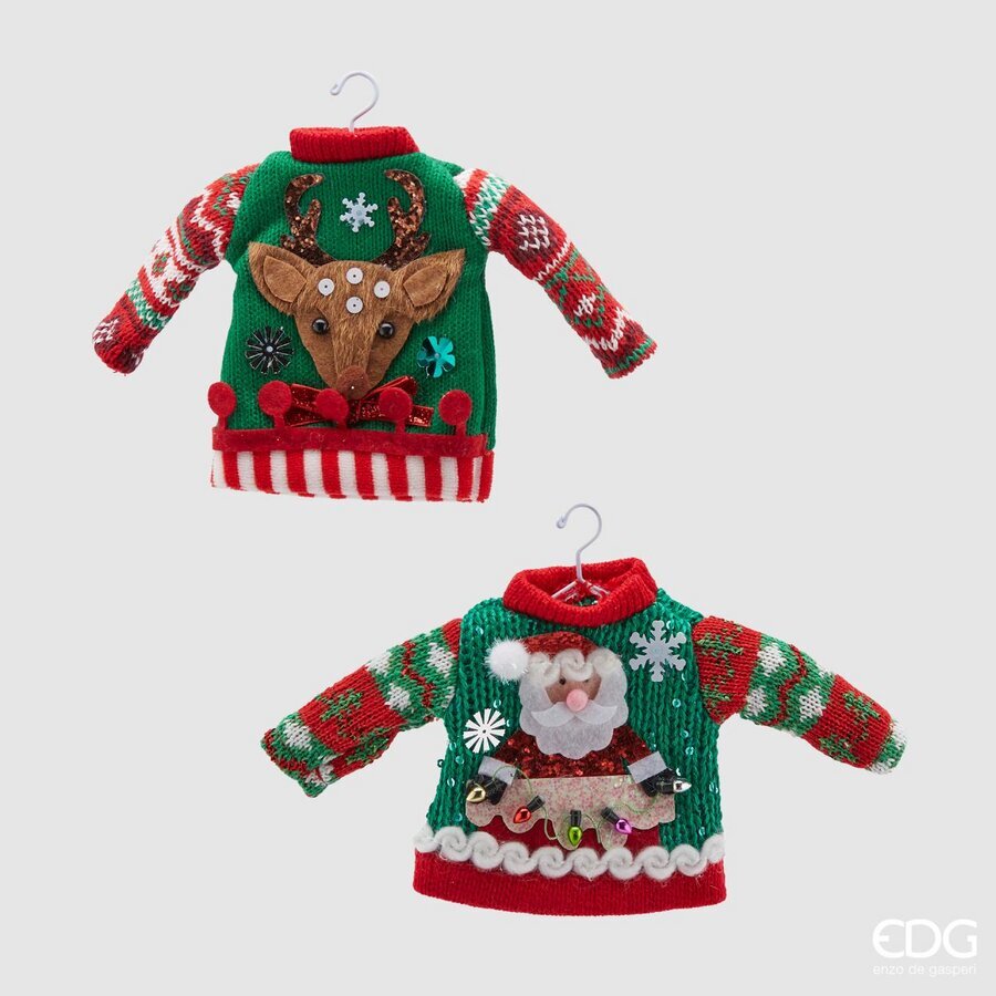 Realizzato in cotone e decorato con applicazioni varie, provvisto di mini gruccia in metallo. Dimensioni: cm 19 x 12 h. In negozio e online su tuttochic.live