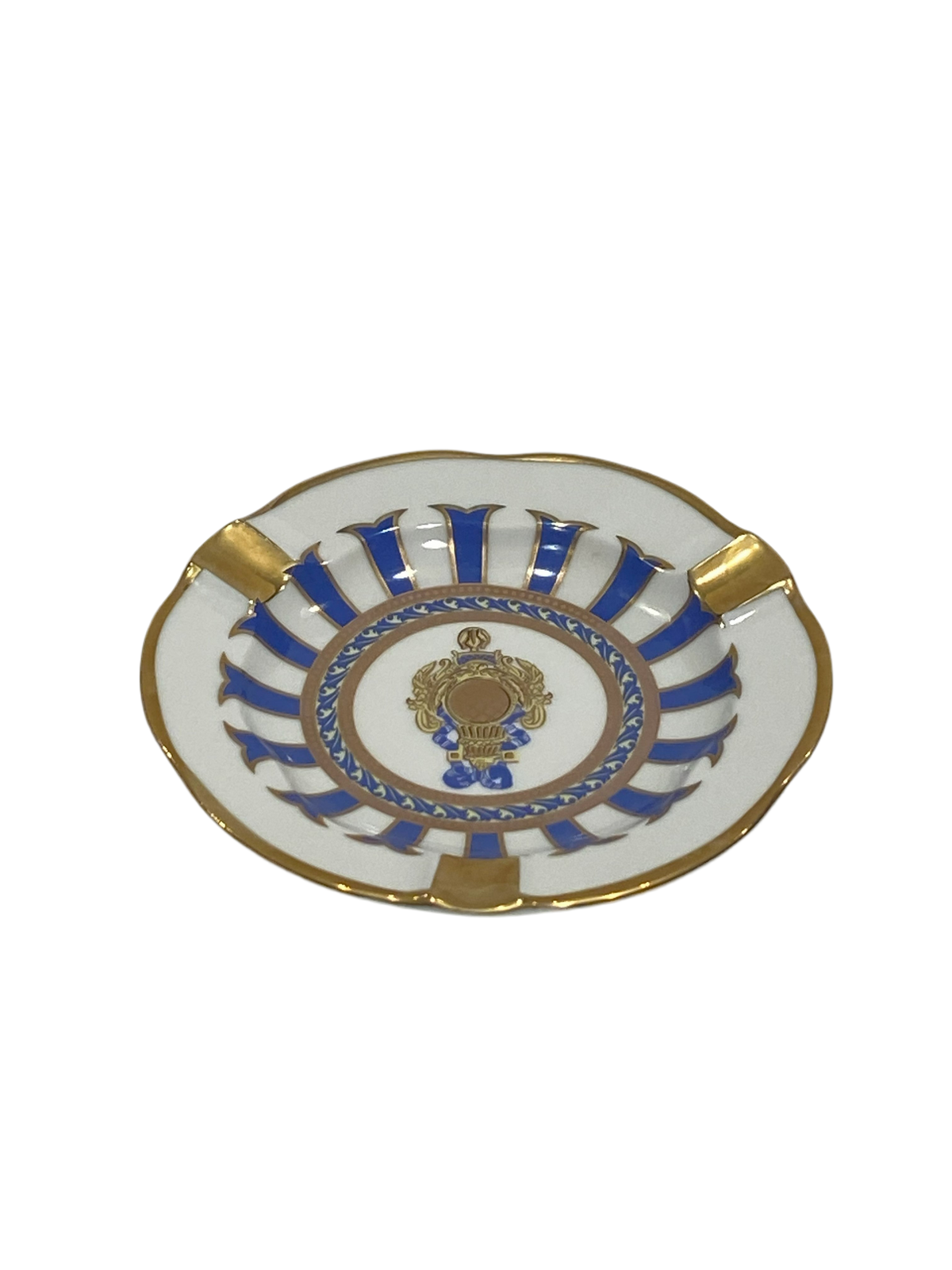 Piattino tondo a forma di posacenere in porcellana Limoges con decoro in oro zecchino e blu.  Dimensioni: cm ø 12 x h 2. In negozio e online su tuttochic.live