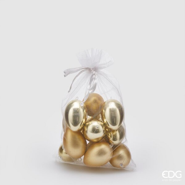 Sacchetto contenente 12 uova in plastica di colore oro, 6 lucide e 6 opache. Dimensioni: h 6 cm. In negozio e online su tuttochic.live