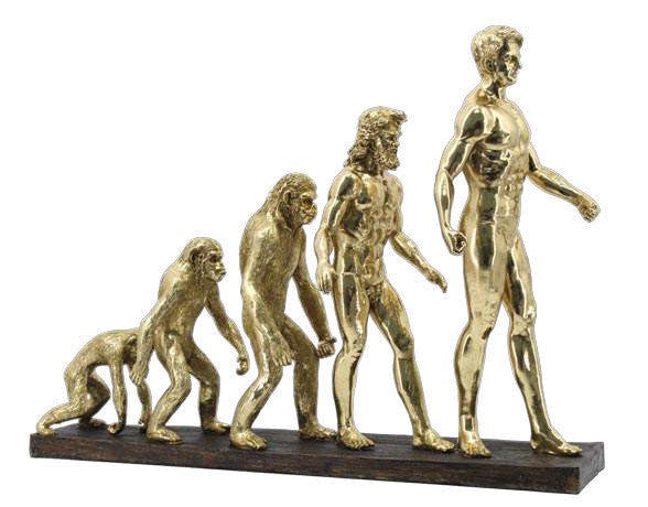 Scultura moderna che rappresenta l'evoluzione dell'uomo, finitura oro lucido su base scura, lunghezza 58 cm, brand Ambienti Glamour, Tutto Chic.
