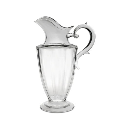 Brocca Elizabeth 1,75 litri in acrilico trasparente della delicata collezione Aqua. Le perfette linee classiche trovano spazio ed espressione in oggetti capaci di coniugare la seduzione di un design raffinato. Dimensioni: Ø 14 cm / h 30,5 cm. Lavabile in Lavastoviglie. No microonde. In negozio e online su tuttochic.live