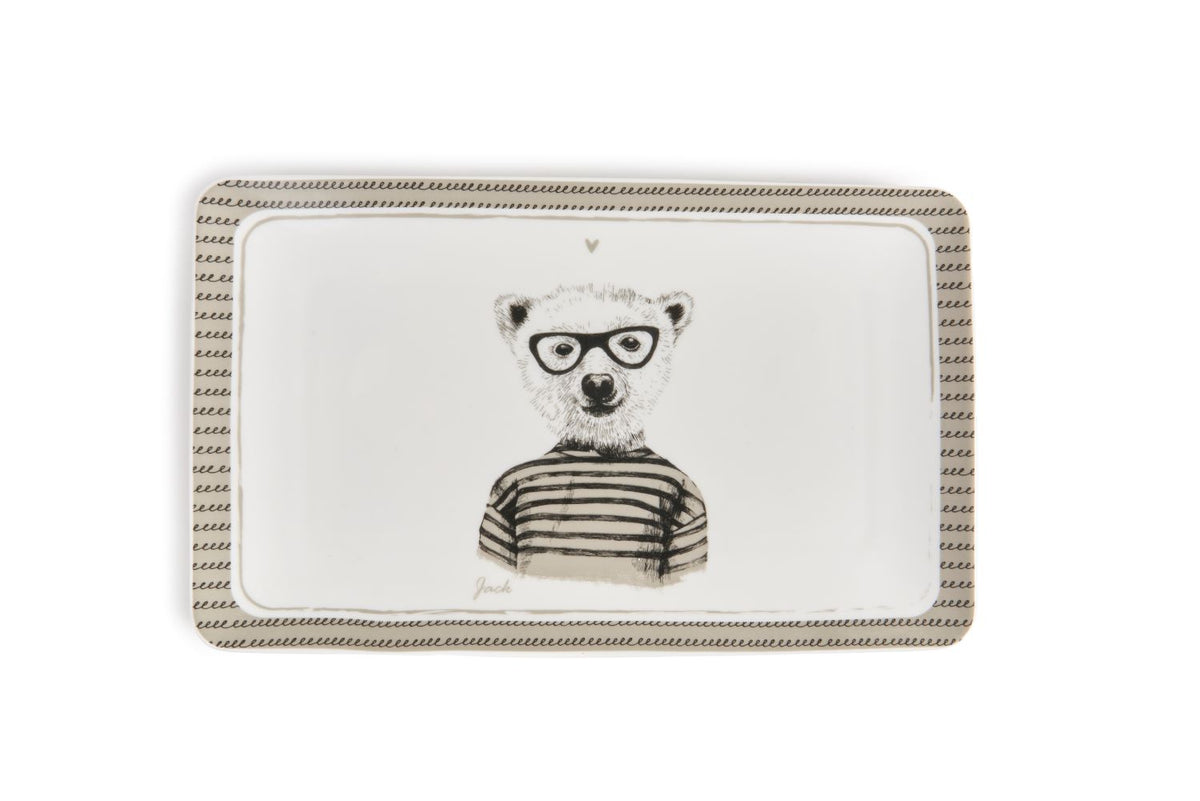 Il piatto rettangola in porcellana decorata con un amabile orso, Ideale per servire i tuoi alimenti preferiti o come piatto vuotatasche decorativo. Dimensioni: cm 21x13x1.6. In negozio e online su tuttochic.live