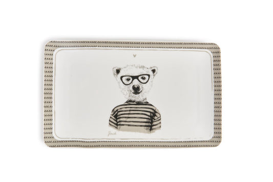 Il piatto rettangola in porcellana decorata con un amabile orso, Ideale per servire i tuoi alimenti preferiti o come piatto vuotatasche decorativo. Dimensioni: cm 21x13x1.6. In negozio e online su tuttochic.live