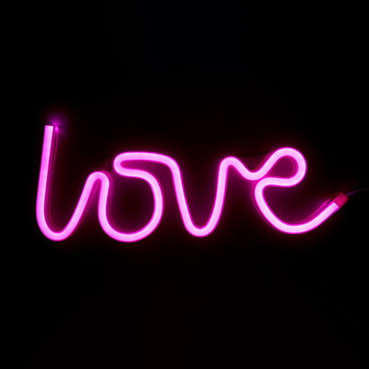 Divertente lampada da parete al neon a led di colore fucsia con la scritta "love", Peso 182 g Dimensioni: cm 34,5 x 13 x 17. In negozio e online su tuttochic.live