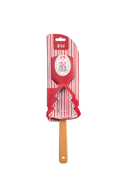 Set regalo natalizio da pasticceria Magic Noel di Nuvole di Stoffa composto da una spatola leccapentole in silicone rosso con manico in legno naturale e uno stampino tagliabiscotti in acciaio a forma di albero di Natale con fiocco a quadri, Tutto Chic.