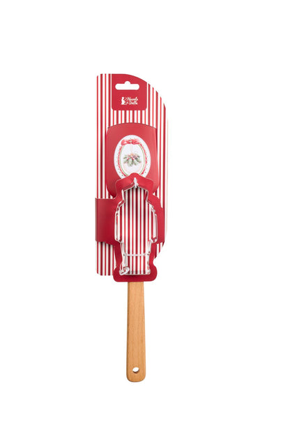 Set regalo natalizio da pasticceria Magic Noel di Nuvole di Stoffa composto da una spatola leccapentole in silicone rosso con manico in legno naturale e uno stampino tagliabiscotti in acciaio a forma di soldatino schiaccianoci con fiocco a quadri, Tutto Chic.