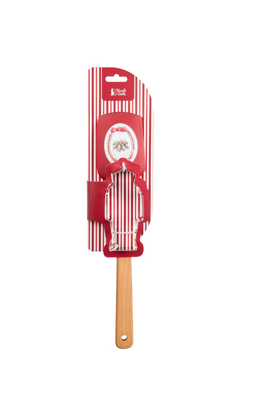 Set regalo natalizio da pasticceria Magic Noel di Nuvole di Stoffa composto da una spatola leccapentole in silicone rosso con manico in legno naturale e uno stampino tagliabiscotti in acciaio a forma di soldatino schiaccianoci con fiocco a quadri, Tutto Chic.