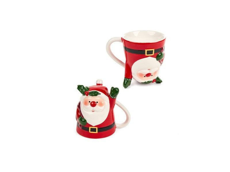 Tazza Babbo Natale della collezione "Cartoline di Natale" di Nuvole di Stoffa. Realizzata in ceramica decorata, questa tazza unica è disponibile in due modelli diversi e poggiata al contrario, si trasforma in un'originale oggetto d'arredo. Capacità 300 ml. In negozio e online su tuttochic.live