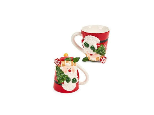 Tazza Babbo Natale della collezione "Cartoline di Natale" di Nuvole di Stoffa. Realizzata in ceramica decorata, questa tazza unica è disponibile in due modelli diversi e poggiata al contrario, si trasforma in un'originale oggetto d'arredo. Capacità 300 ml. In negozio e online su tuttochic.live
