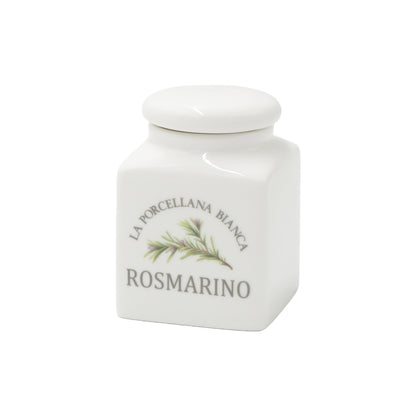 Barattolino in porcellana decorato ROSMARINO Capacità: 175 cc. Dimensioni : 6,5x6xh9 cm Portano colore in cucina i funzionali barattoli Conserva, con un’intuitiva illustrazione per catalogare spezie, tè, caffè e tisane, tutti dotati di un pratico tappo a chiusura ermetica. In negozio e online su tuttochic.live