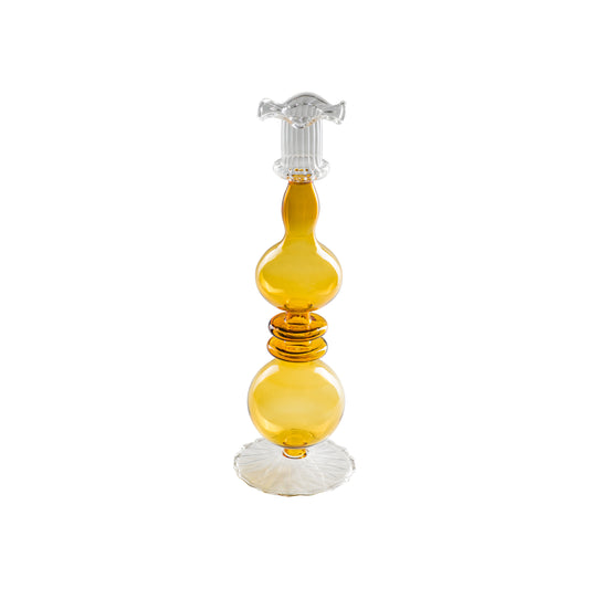 Portacandela "Allacorte". Realizzato in vetro borosilicato con tonalità di colore ambra. Dimensioni: Ø 9 x 28 h cm. In negozio e online su tuttochic.live 