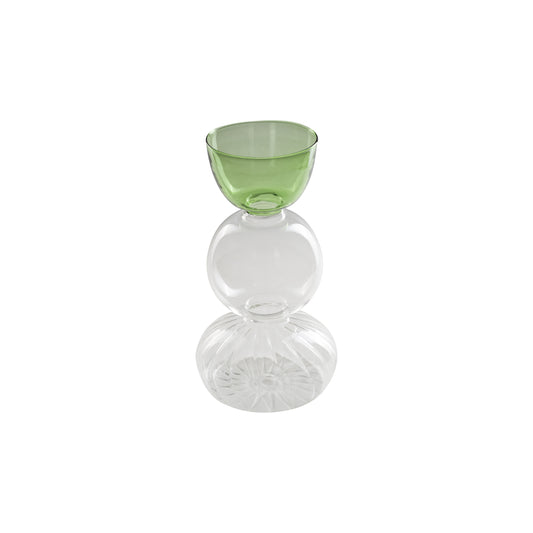 Vaso monofiore M verde è un elegante e raffinato pezzo di design realizzato in vetro borosilicato.  Dimensioni: cm Ø 12 x 23 h. In negozio e online su tuttochic.live