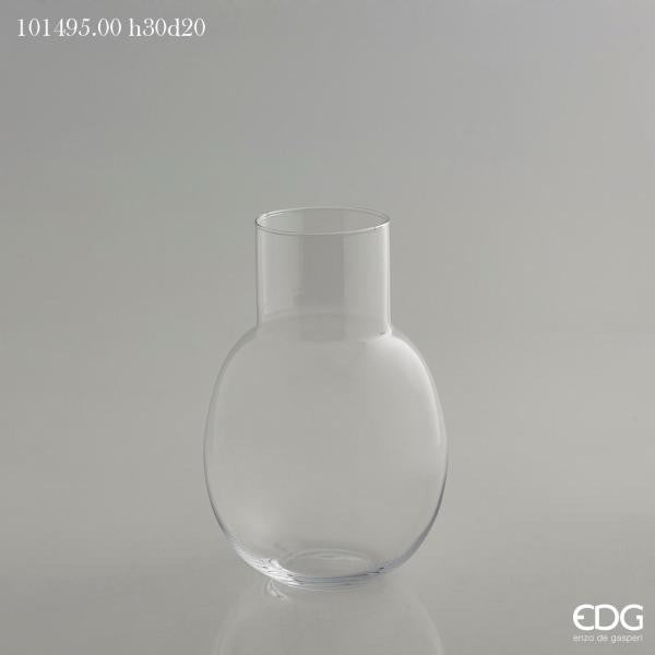 Vaso bombato in vetro trasparente con collo. Dimensioni: cm h 30 x ø 20 ( bocca collo ø 10 cm). In negozio e online su tuttochic.live