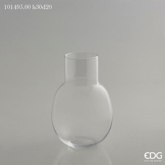 Vaso bombato in vetro trasparente con collo. Dimensioni: cm h 30 x ø 20 ( bocca collo ø 10 cm). In negozio e online su tuttochic.live