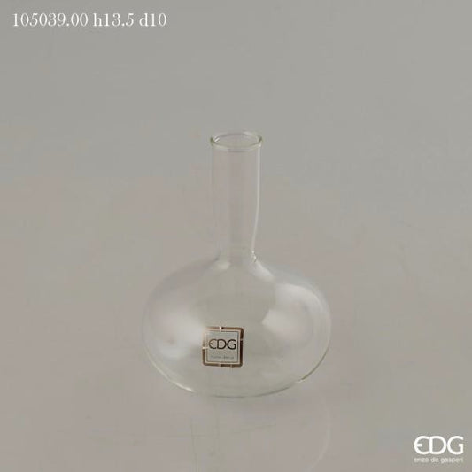 Vasetto ampolla in vetro trasparente, ideale come vaso monofiore o ampolla per profumi ambiente. Dimensioni: cm ø 10 x h 13,5 (diametro bocca cm 2,5). In negozio e online su tuttochic.live