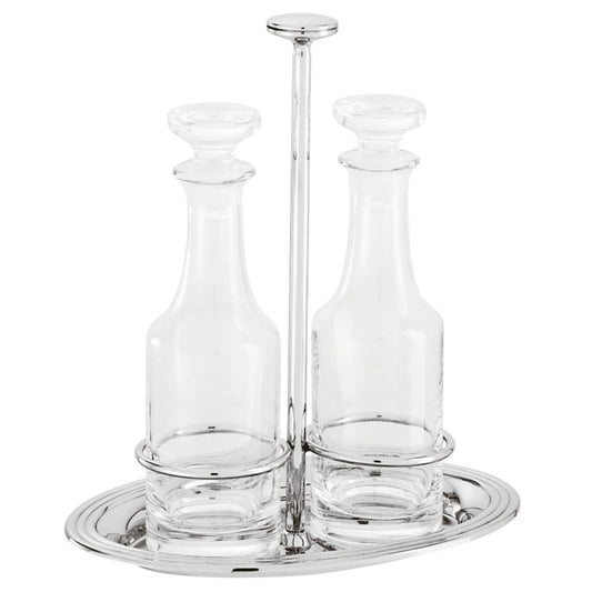 Servizio oliera e acetiera in acciaio argentato e cristallo della collezione Elite di Sambonet. Provvedere ad una lucidatura con l’ausilio di specifici prodotti per l'argento. Dimensioni: Altezza: 21,7 cm larghezza: 12,80 cm, lunghezza: 19.20 cm Peso dell'articolo: 920 gr. In negozio e online su tuttochic.live