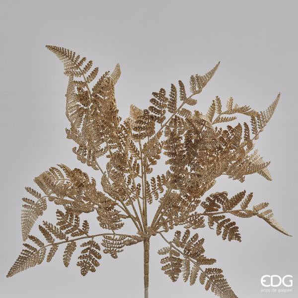 Cespuglio di Felce ornamentale artificiale di colore oro glitter. Dimensioni: cm 46 h. In negozio e online su tuttochic.live