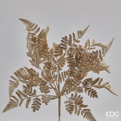 Cespuglio di Felce ornamentale artificiale di colore oro glitter. Dimensioni: cm 46 h. In negozio e online su tuttochic.live