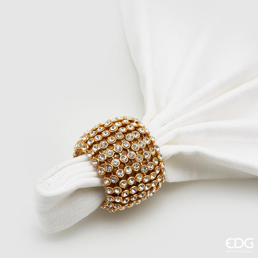 Legatovagliolo tondo color oro decorato con tessuto e strass. Dimensioni: Ø cm 6. In negozio e online su tuttochic.live