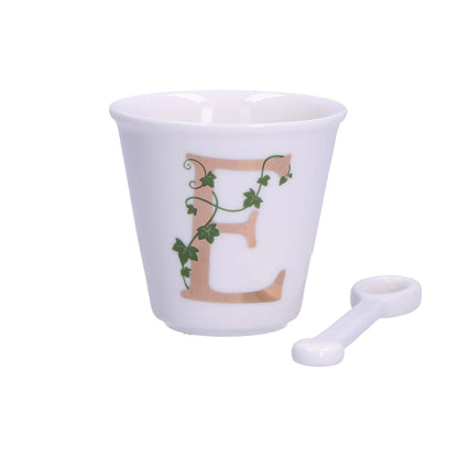 "Unico" Bicchierino in porcellana con iniziale decorata e cucchiaino. Capacità 75 cc Dimensioni: diametro cm 6,7- altezza cm 6 Lavare a mano 