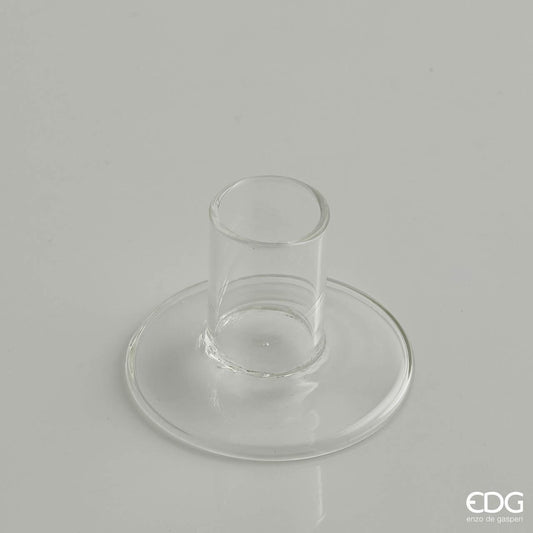 Portacandele base in vetro trasparente. Dimensioni: cm Ø 7 x 5 h, foro Ø 2,5 cm. In negozio e online su tuttochic.live