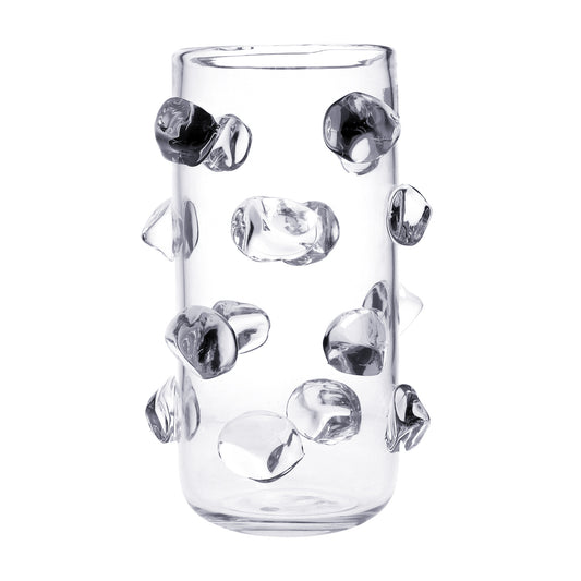 Vaso portafiori in vetro trasparente con applicazioni a forma di sassi sempre in vetro trasparente. Dimensioni: Ø 20 ; h 32,5 cm, peso: 3,5 kg. In negozio e online su tuttochic.live