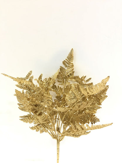 Cespuglio di Felce ornamentale artificiale di colore oro glitter. Dimensioni: cm 46 h. In negozio e online su tuttochic.live