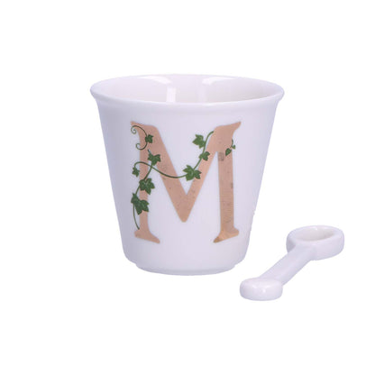 "Unico" Bicchierino in porcellana con iniziale decorata e cucchiaino. Capacità 75 cc Dimensioni: diametro cm 6,7- altezza cm 6 Lavare a mano 