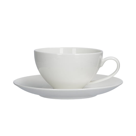 Tazza colazione con piattino in porcellana bianca, capacità 350 cc. Less is more: sono iperminimal le linee di Essenziale, set tavola in Bone China dalle forme morbide, perfetto per ogni occasione. Lavabile in lavastoviglie Utilizzabile in microonde Utilizzabile in forno tradizionale