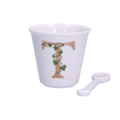 "Unico" Bicchierino in porcellana con iniziale decorata e cucchiaino. Capacità 75 cc Dimensioni: diametro cm 6,7- altezza cm 6 Lavare a mano 