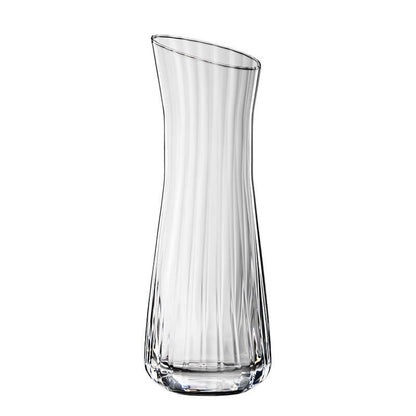 Caraffa in vetro cristallino lavorato. Dimensioni: mm 75 x 223 h - Capacità: 310 ml. Lavabile in lavastoviglie